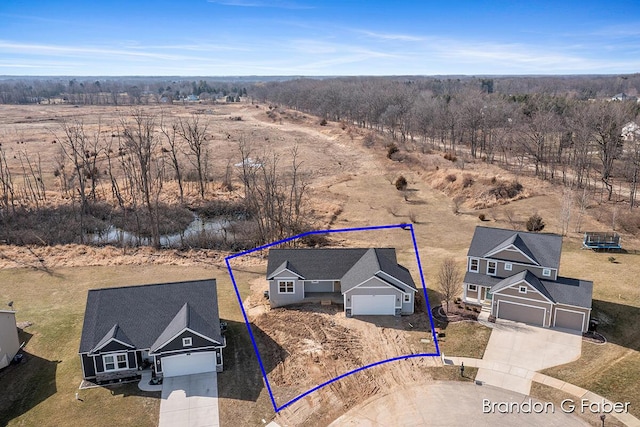 birds eye view of property featuring a rural view