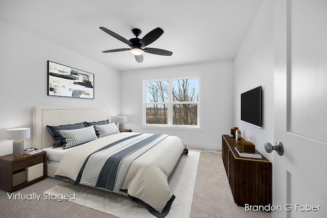 bedroom featuring light tile patterned floors and a ceiling fan