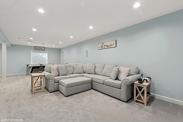 living area with recessed lighting, baseboards, and light carpet