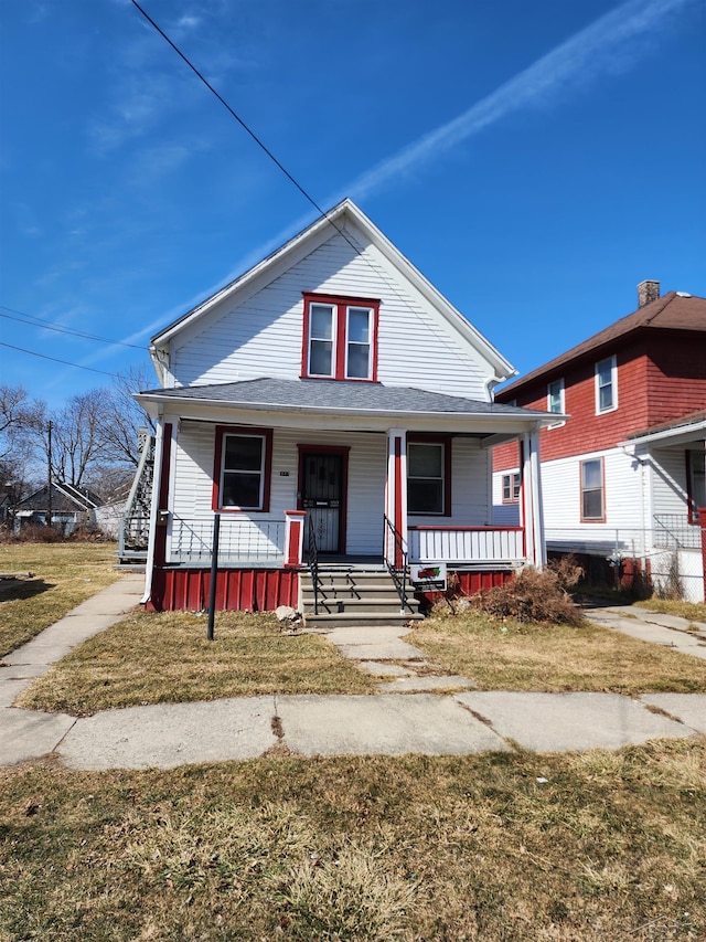 bungalow featuring a porch and a front yard