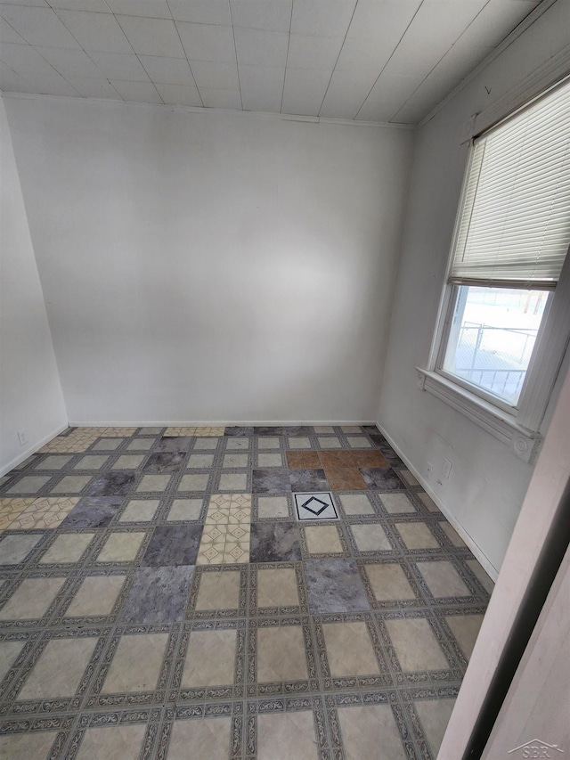 unfurnished room with tile patterned floors