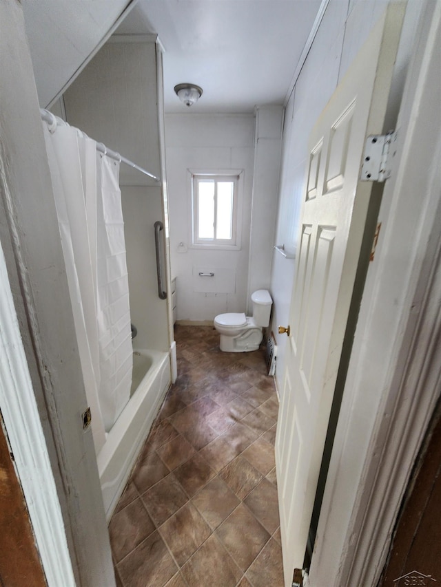 bathroom featuring shower / bath combination with curtain and toilet