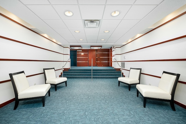 living area featuring carpet flooring, recessed lighting, stairs, and baseboards