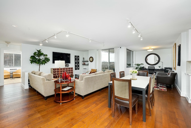 dining area with dark wood-style flooring