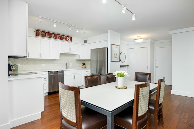 dining space featuring visible vents and dark wood-style flooring