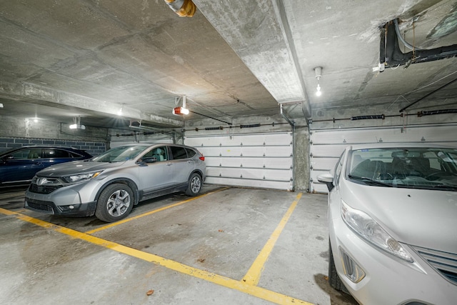 parking garage featuring a garage door opener