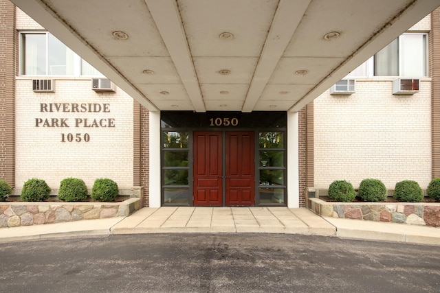 property entrance with brick siding