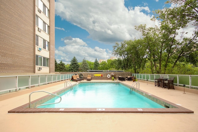 pool featuring a patio area