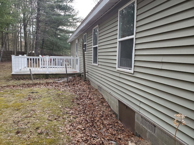 view of home's exterior featuring fence