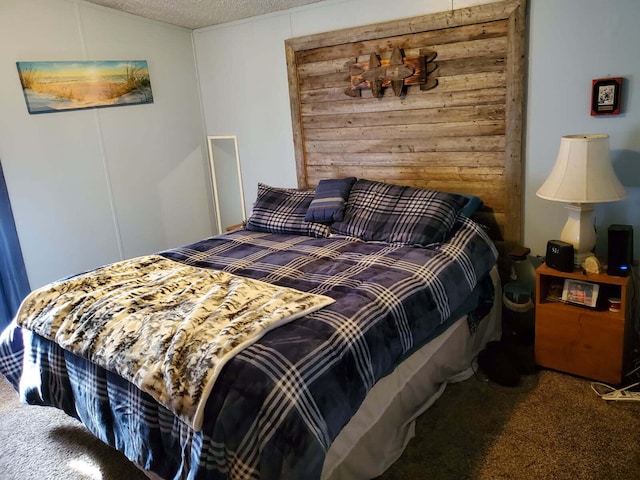 carpeted bedroom with a textured ceiling