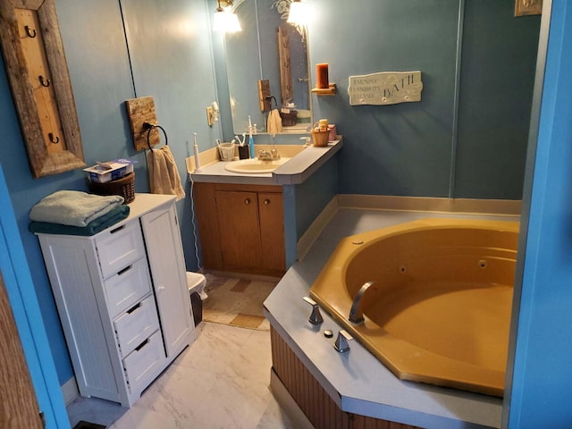 full bath featuring a jetted tub and vanity