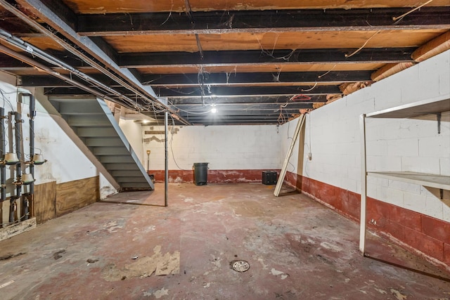 unfinished basement with stairway