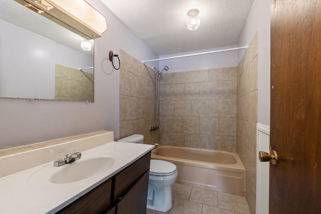 bathroom with toilet, a textured ceiling, tile patterned flooring, bathing tub / shower combination, and vanity