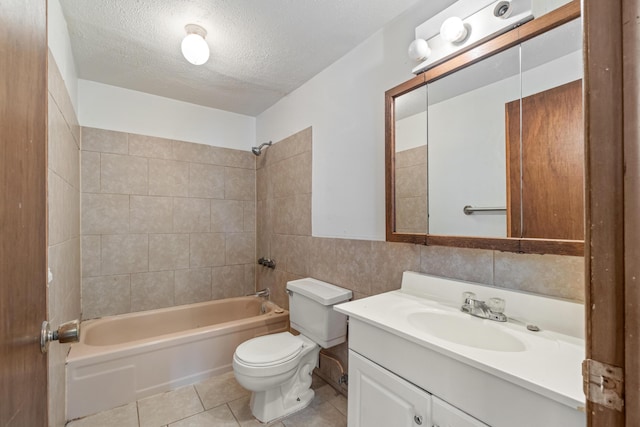 bathroom featuring toilet, a textured ceiling, shower / washtub combination, tile walls, and tile patterned flooring