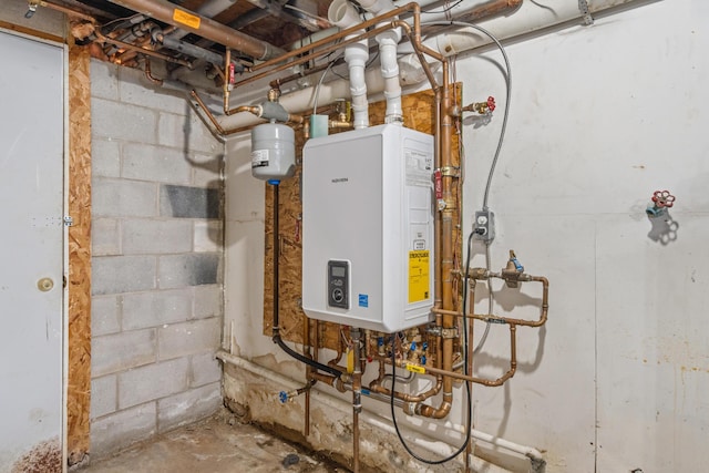 utility room with tankless water heater