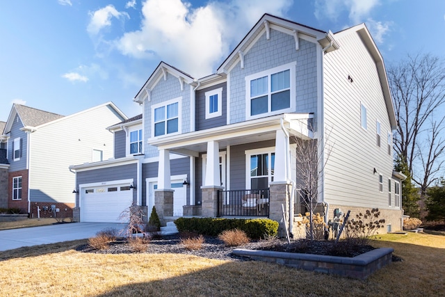 craftsman house featuring a garage, stone siding, covered porch, and concrete driveway