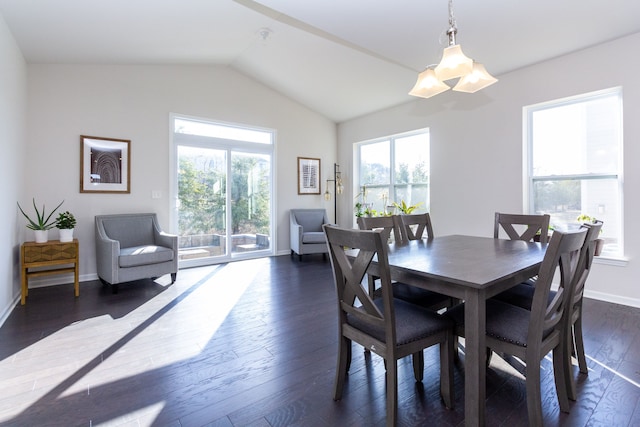 dining room with dark wood finished floors, a chandelier, baseboards, and lofted ceiling