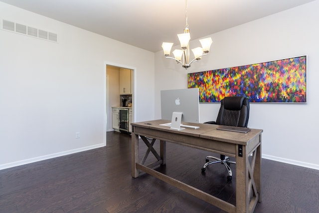 office space featuring dark wood-style floors, beverage cooler, visible vents, baseboards, and an inviting chandelier