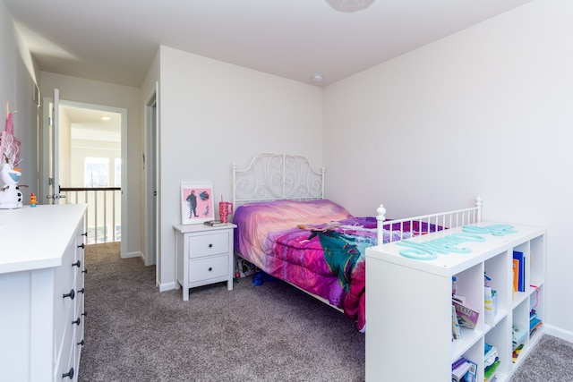 carpeted bedroom with baseboards