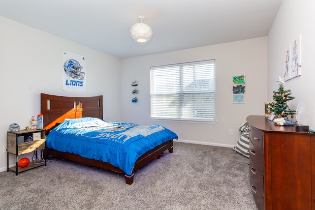 bedroom with baseboards and carpet floors