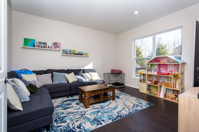 living room with recessed lighting, wood finished floors, and baseboards