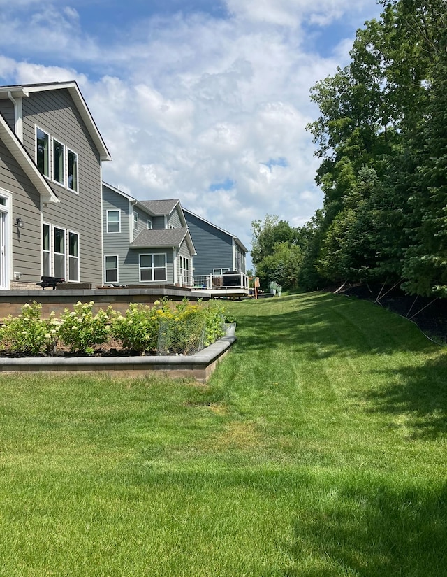 view of yard with a wooden deck