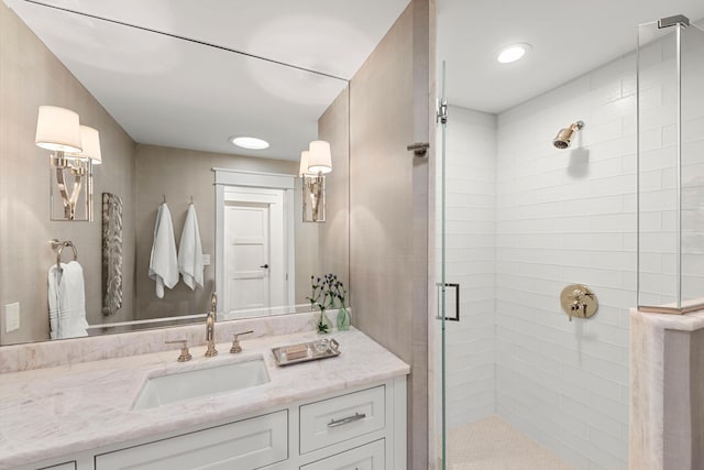 full bathroom with vanity and a shower stall