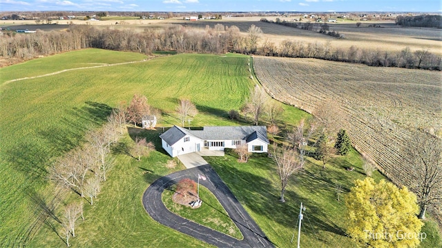 birds eye view of property with a rural view