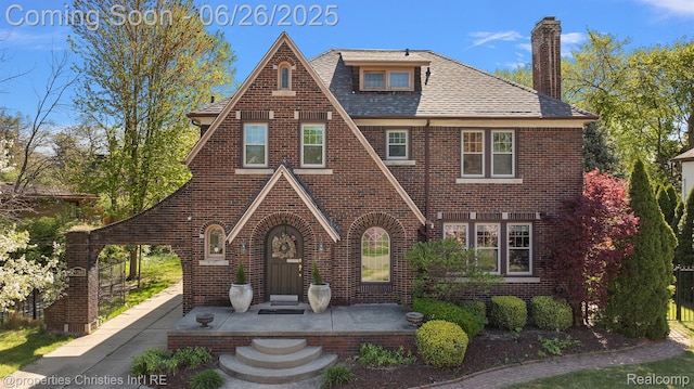 19344 Strathcona Dr, Detroit, MI 48203 - tudor-style house featuring brick siding and a chimney
