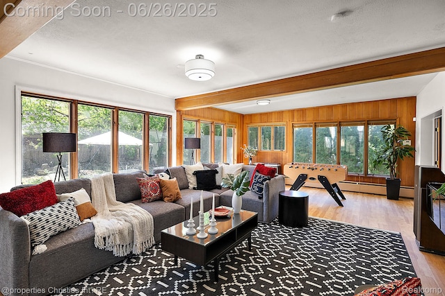 19344 Strathcona Dr, Detroit, MI 48203 - living area featuring light wood-style floors, beam ceiling, wooden walls, and a textured ceiling