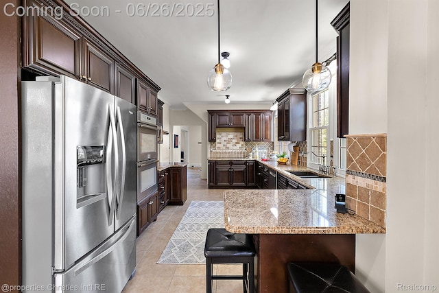 19344 Strathcona Dr, Detroit, MI 48203 - kitchen featuring stainless steel appliances, dark brown cabinetry, light stone counters, decorative backsplash, and light tile patterned floors