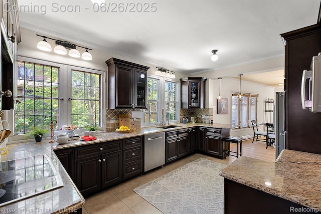 19344 Strathcona Dr, Detroit, MI 48203 - kitchen featuring stainless steel dishwasher, black electric stovetop, tasteful backsplash, crown molding, and glass insert cabinets