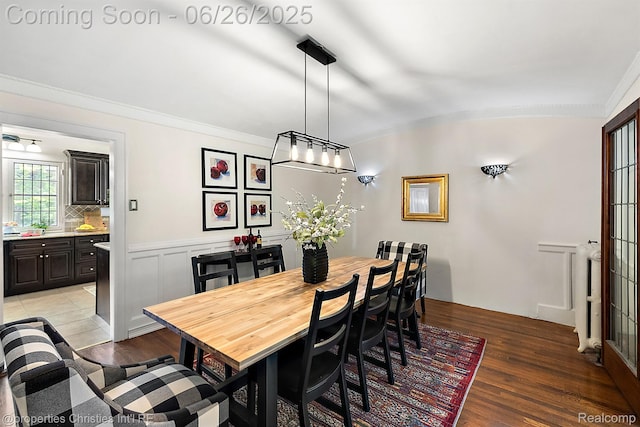 19344 Strathcona Dr, Detroit, MI 48203 - dining area featuring light wood finished floors and ornamental molding
