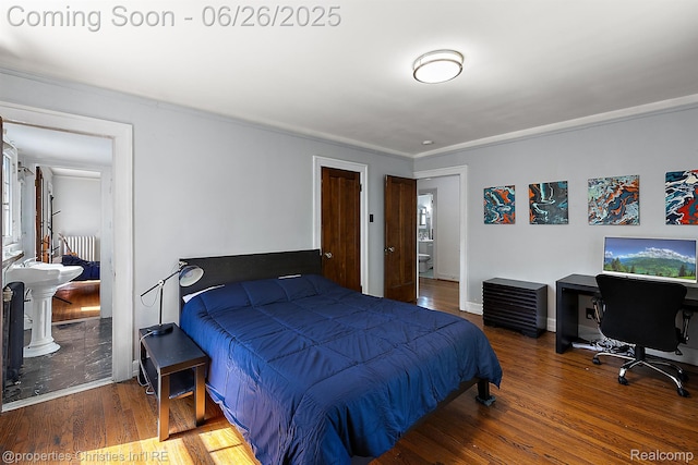 19344 Strathcona Dr, Detroit, MI 48203 - bedroom with radiator, wood finished floors, and an office area