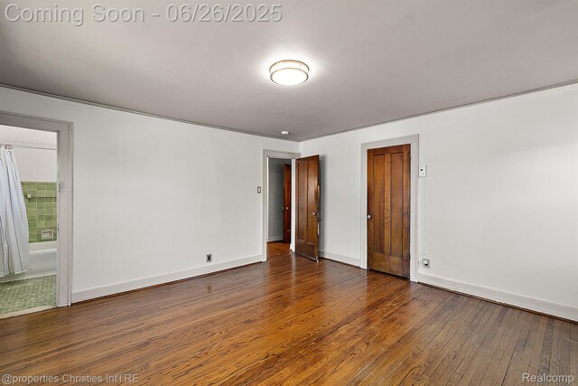 19344 Strathcona Dr, Detroit, MI 48203 - unfurnished bedroom with wood-type flooring and ensuite bathroom