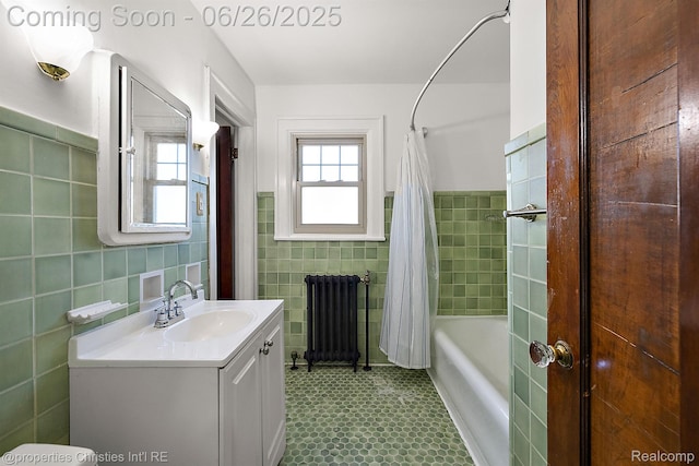 19344 Strathcona Dr, Detroit, MI 48203 - full bath with radiator, tile walls, vanity, shower / tub combo with curtain, and wainscoting
