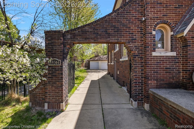 19344 Strathcona Dr, Detroit, MI 48203 - view of side of property featuring brick siding, an outbuilding, and a detached garage