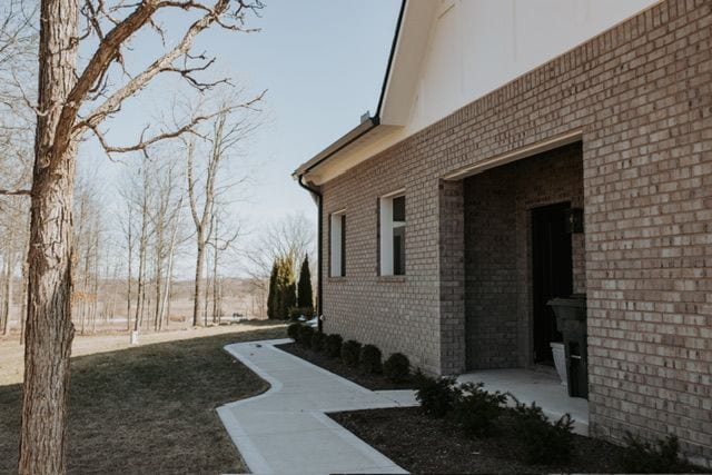 72460 Henry D Dr, Romeo, MI 48065 - view of property exterior featuring brick siding