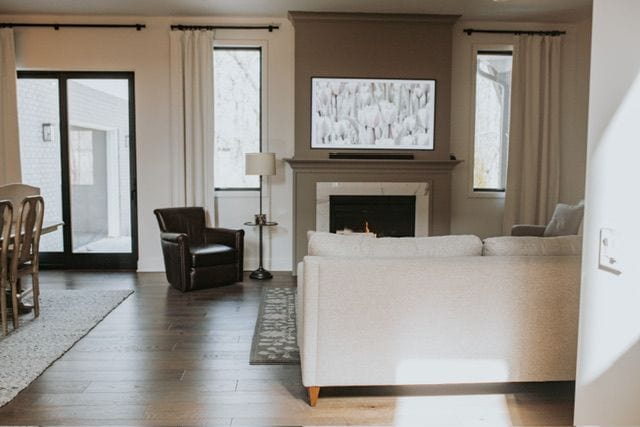 72460 Henry D Dr, Romeo, MI 48065 - living area with wood finished floors and a warm lit fireplace