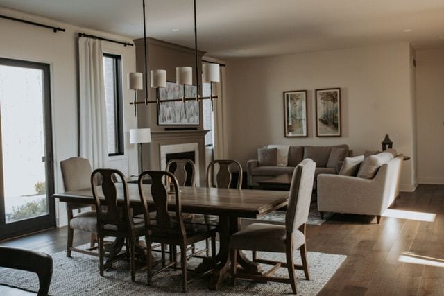 72460 Henry D Dr, Romeo, MI 48065 - dining space featuring wood finished floors and a fireplace