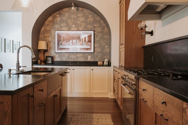 72460 Henry D Dr, Romeo, MI 48065 - kitchen with dark wood-style flooring, a sink, extractor fan, high end stainless steel range, and dark countertops