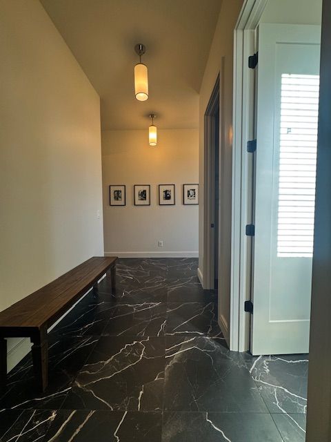 72460 Henry D Dr, Romeo, MI 48065 - corridor with baseboards, plenty of natural light, and marble finish floor