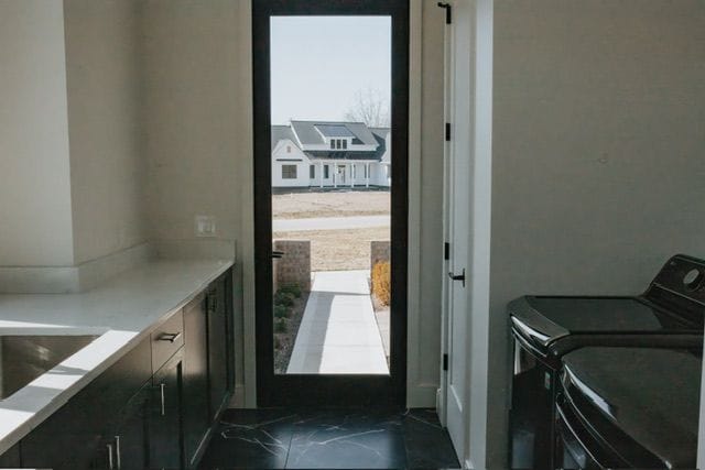 72460 Henry D Dr, Romeo, MI 48065 - laundry room with separate washer and dryer and laundry area