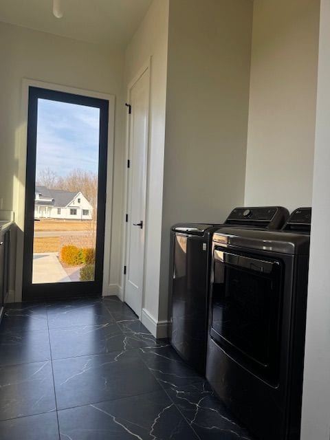 72460 Henry D Dr, Romeo, MI 48065 - clothes washing area featuring laundry area, washer and dryer, and baseboards