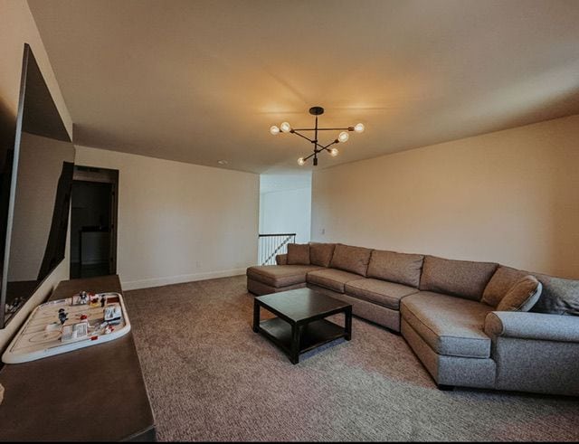 72460 Henry D Dr, Romeo, MI 48065 - living area featuring a chandelier, baseboards, and carpet floors