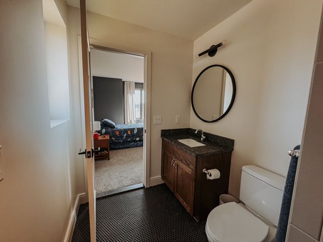 72460 Henry D Dr, Romeo, MI 48065 - half bathroom with vanity, toilet, and baseboards