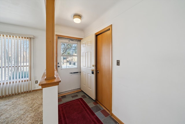 entryway featuring tile patterned floors and baseboards