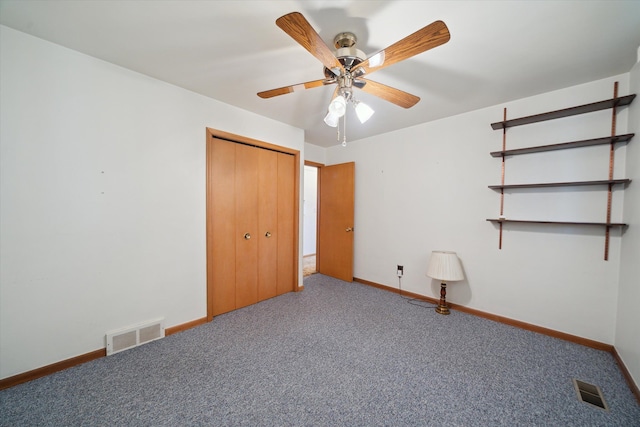 unfurnished bedroom featuring visible vents, carpet flooring, and baseboards