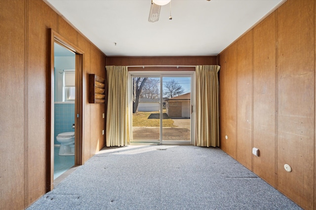 carpeted empty room with ceiling fan