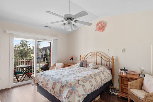 bedroom with vaulted ceiling, access to outside, a ceiling fan, and visible vents